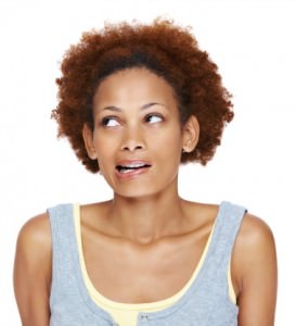 African American woman with natural hair looking confused