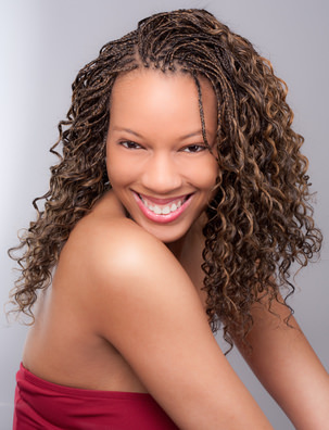 African American woman with curly brown braids