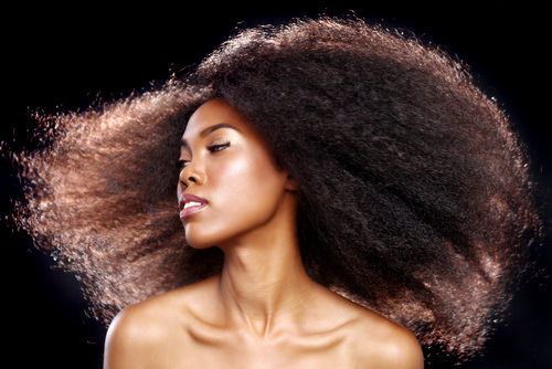 Black woman with long flowing kinky natural hair