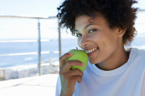 Woman eating an apple