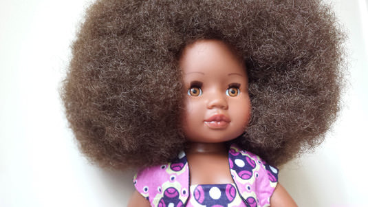 black doll with afro hair