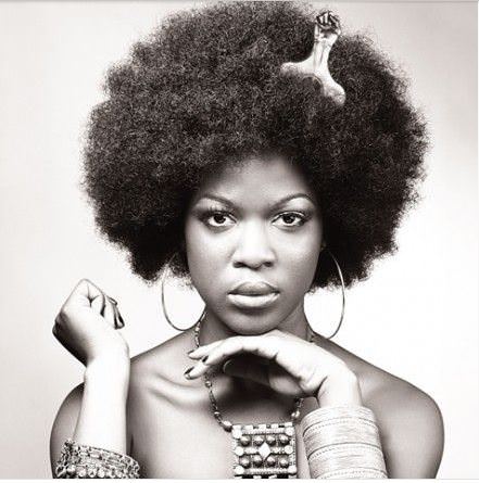 Woman with afro pick