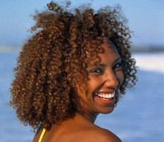 Young woman wearing bikini, smiling, portrait